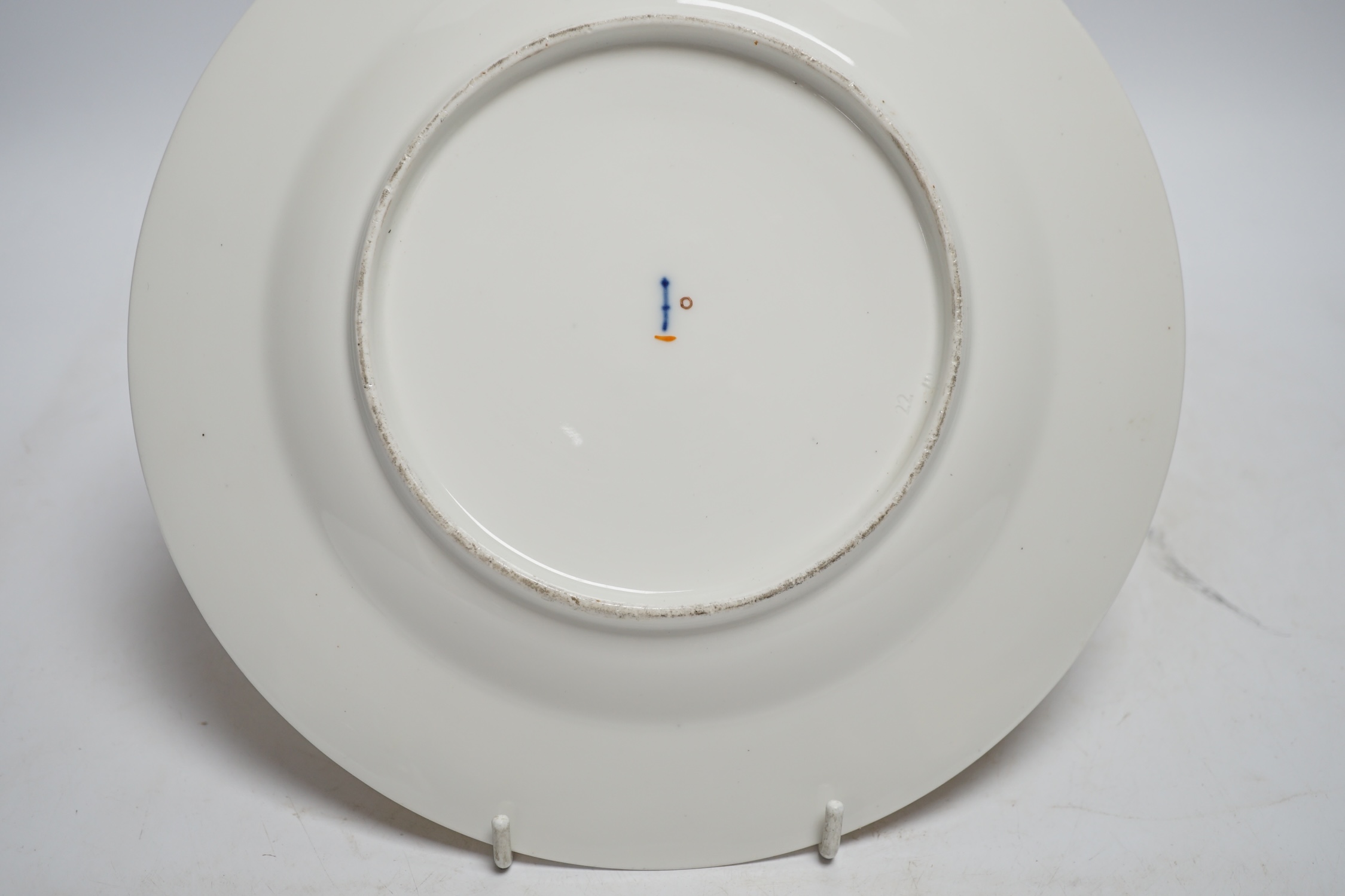 A Berlin porcelain dish painted with a groom with horses, first half of 19th century, 25cm diameter
